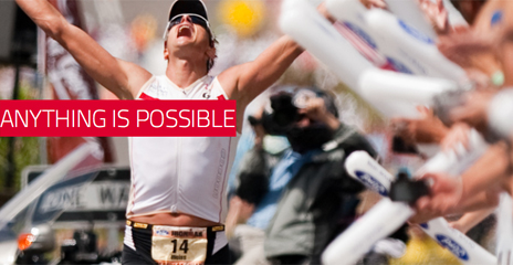 Photo of Ironman participant crossing the finish line, with caption: anything is possible.