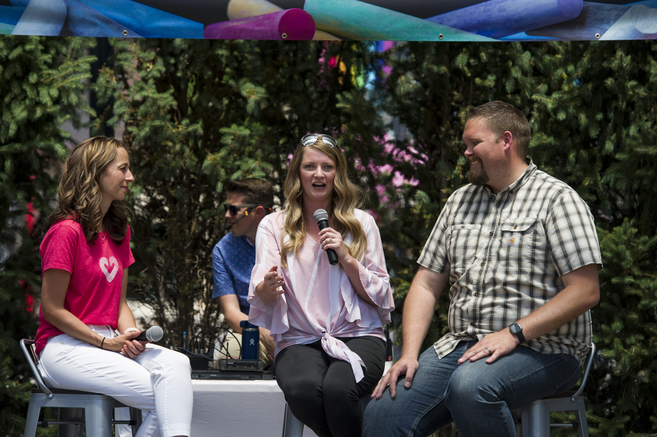 Foster parents Ashley and Josh Wadsworth with First Lady Abby Cox at the UFC Chalk Art Festival